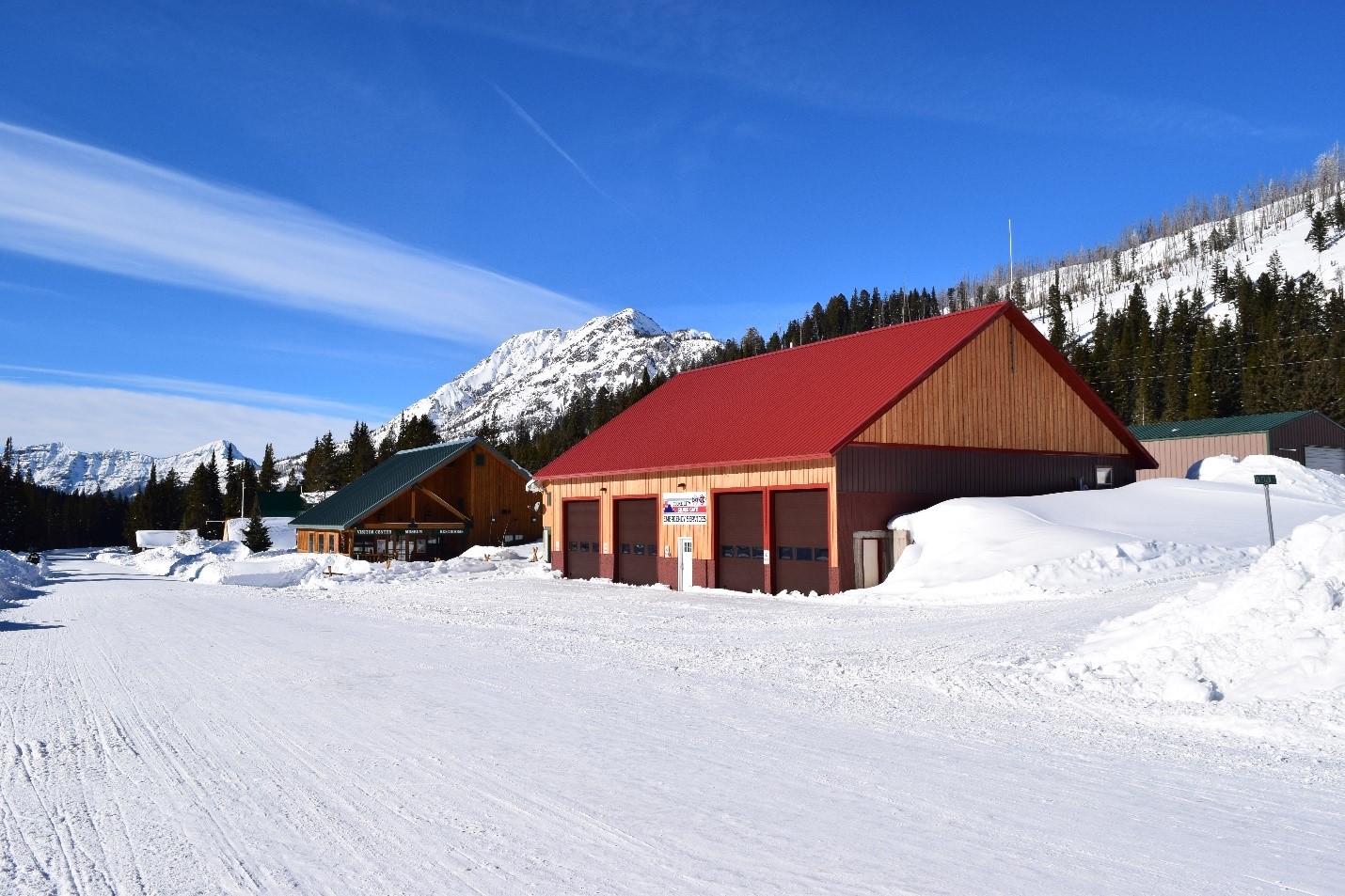 Caption: The Community Center, green roof, houses the only public bathrooms in Cooke City. 